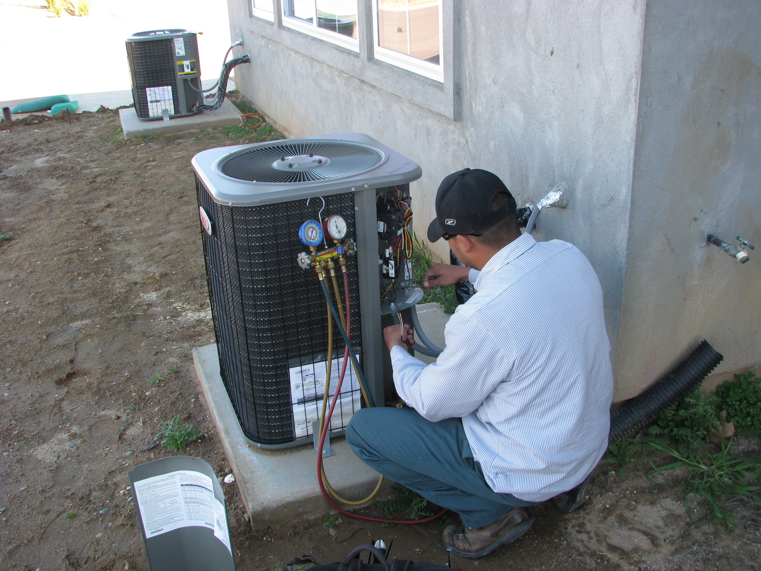 Technician working on Air conditioner unit